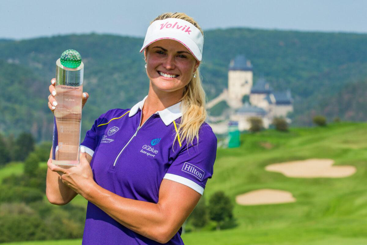Carly Booth with a tournament trophy