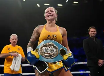 Ebanie Bridges with championship belts